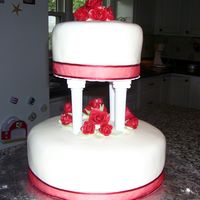Red Rose Wedding Cake My first paid wedding cake! YAHOO! It was for a friend, but you have to start somewhere! I used MMF for the roses and the cake. Amazingly,...