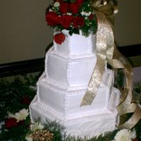 Christmas Wedding Cake This cake was white cake with lemon or raspberry filling and was a Christmas wedding. Monogram was made from royal icing.