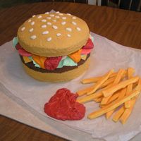 Hamburger And Fries Cake I made this cake for my niece's birthday party Hamburger white cake (bun) and chocolate cake (burger). I piped dots of chocolate icing...