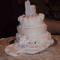 Happily Ever After Wedding Cake This cake is chocolate with chocolate cream filling covered in almond flavored buttercream. My friend got the idea from the Wilton 2004...