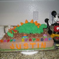 Dinosaur Cake For Justin This cake was done for my little boy who turned 3. He loves dinosaurs and I found a sketch on how to make a dinosaur, so I tried it and he...