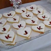 J & K Cookies For Bridal Shower plain sugar cookies, filled with raspberry jam and covered with cookie icing. sprinkled with edible glitter.