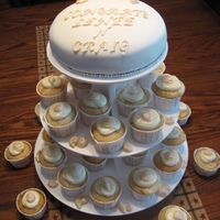Beach Shower Cake And Cupcakes Cake is vanilla with RI. Cupcakes are Tiramisu. Seashells were made with white chocolate