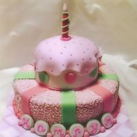 Kamryn I made this for a 1st birthday. The cakes are marble with bc & fondant. the candle is a dowel rod covered in fondant. this was the...