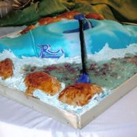 Kayak The kayak is the only cake, the rocks in the water is chocolate rocks & i used color flow for the waves & piping gel for the clear...