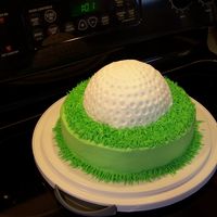 Golf Ball Cake I made this cake for my dad's birthday. The "grass" cake was white cake, and I did the ball in chocolate fudge cake. Frosted...