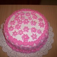 100_1185.jpg buttercream icing basket weave on the side with swirl flowers on top rosette top border and swirl flowers for the bottom border