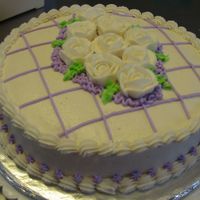 A Cake For A Friend White buttercream, white roses with purple detail