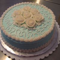 One Of My First Cakes Skyblue buttercream with white roses/borders.I attempted Cornelli lace.