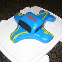 Airplane My son wanted a blue airplane with a yellow stripe and this is what he got! It is funny how specific kids can be sometimes. I made the cake...