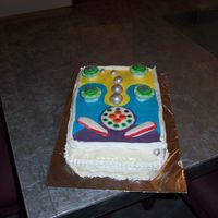 Pinball Cake This was a birthday cake I made for my husband. He loves pinball. This a rectangle pan and assorted fondant decorations.