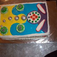 Pinball I made this cake for my husbands birthday. He loves pinball The cake is a rectangle with fondant decorations.