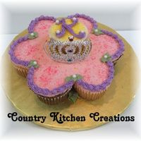 Small Flower And Tiara Cupcake Cake 8 small cupcakes leftover from larger tiar cupcake cake- made into a flower shape and the "K" is for the birthday girl- Kayli