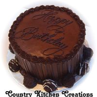 Chocoholic's Dream 8" triple chocolate fudge cake, chocolate mousse filling, triple chocolate fudge icing, Hershey's special dark choclate drizzle...