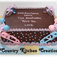 Twins Shower Boy And Girl 9x13 double layer triple chocolate fudge cake- pink and blue together from fraternal twins- one boy and one girl- babies were truely heaven...