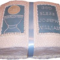 Joseph's Christening Cake Book pan on top of 11x15 sheet cake- cornelli lace- blue and ivory candy clay