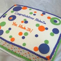 Polka Dot Graduation 11x15 double layer cake- one layer french vanilla one layer triple chocolate fudge with strawberry creme and strawberry puree filling...