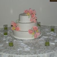 Floral Wedding Cake Vanilla cake w/ lemon & raspberry buttercream, choco-pan covering, gumpaste roses.
