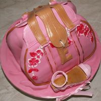 Fashion Forward Mum! Purse is made from chocolate cake. Covered with fondant and decorated with gumpaste. The fashionable wedge is made with gumpaste and...