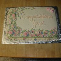 Baby Girl BC and fondant flowers done in shades of pink with violet accents.