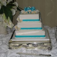 Calla Lily The calla lillies are all made of gumpaste and the bow is ribbon. They didn't save the top tier so all of it was served. These were 10...