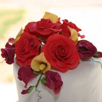 Floral Topper For Angies Wedding Roses, sweet peas and calla lilys. This was a last minute type wedding for a my best friend's mom.. I was given complete control over...