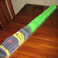 Light Saber Buttercream covered light saber. I made this by baking the cake in an 8.5x11 cake pan. I cut it into strips, one being slightly thicker...