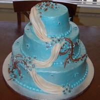 Maryann's Weddingcake This is a marble and lemon wedding cake with buttercream icing. The flowers draping and vines are all fondant. I sprayed it with pearl...