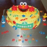 Preslees Elmo Cake I made this for a little girls who is turning 2 and she loves elmo. Vanilla cake with buttercream icing. Fondant decorations. Thanks for...