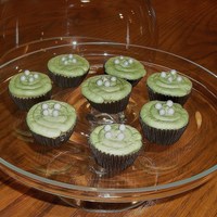 Mini Green Tea Cupcakes Green tea cake with green tea icing, edible pearls on top.