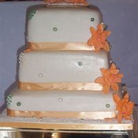 My First Wedding Cake My first wedding cake - almost a heart attack, I was sooo nervous. Anyhow, bride was pleased - Bottom layer fruit and the others are almond...