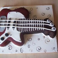 Electric Guitar I had great fun decorating this cake... Fondant covered Choc/almond sponge...
