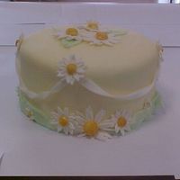 Mvc-001F.jpg This is a fondant covered cake with gumpaste flowers.