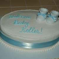 Baby Boy Cake Very simple. Used real ribbon that I got at a craft store. The booties were ceramic that I had actually received for my own baby shower but...