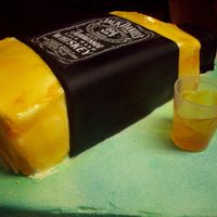Jack Daniels Fairly simple cake... I DID CHEAT and simply print out the "label" and attatched it to black fondant. I iced the bottle in BC and...