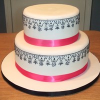 Pink White & Black Black piping on white fondant.