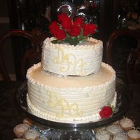 25Th Wedding Anniversary first time using buttercream frosting, vanilla pudding in the center, fresh roses for topper, white chocolate for the monogram. Accented...