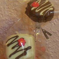 Christmas Cake Truffles On A Stick The chocolate started to crack, the cake truffle was used frozen and made the chocolate crack. Need to work through that..