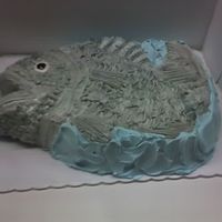 Buttercream Fish Groom's cake. This was done with buttercream tinted grey and brushed with blue and green luster dust. Oversprayed with a silver food...