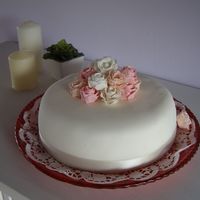 Mother Day Roses Cake chiffon cake filled with strawberries and custard. Covered in sugar fondant.First attempt at roses!