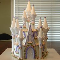 Castle Birthday Cake This is my version of the wilton caslte cake. I had alot of fun doing this cake. There is a very happy 5 year old little girl!