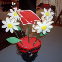 Graduation Cookie Centerpiece NFSC with royal icing. I made 8 of these for a high school graduation party. They took forever and I was still assembling them 5 minutes...
