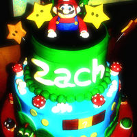 Mario I took alot of different ideas from cc:) All buttercream with fondant figures and accents.