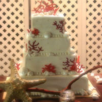 Coral And Shells All buttercream, with RI coral and white chocolate shells. The entire cake and shells are super pearl dusted, but it is hard to see in the...