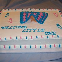 Peek A Boo! Baby is hiding under a buttercream blanket.