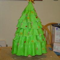 6 Tier Christmas Tree Cake This was a 6 tiered cake - each tier supported by a star shaped acrylic plastic sheet (custom cut). Each tier was cut to match the shape of...