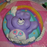 Purple Care Bear Cake I made this cake for a 2 year old's birthday. The bottom tier was a 2 layer 14" round. The top tier was a single layer, with some...