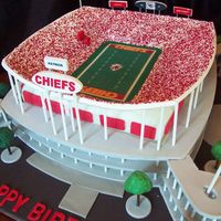 Arrowhead Football Stadium In Kansas City 12" square cake is under the stands. Walkways and stands are pastillage, as well as signs and scoreboard. Everything else is a mixture...