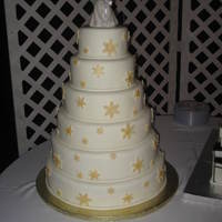 Snowflake Wedding All fondant with gold fondant snowflakes.