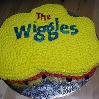 Wiggles Cake Sheet cake cut to look like the Wiggles logo. Covered in Buttercream icing and Wafer Paper used for writing.